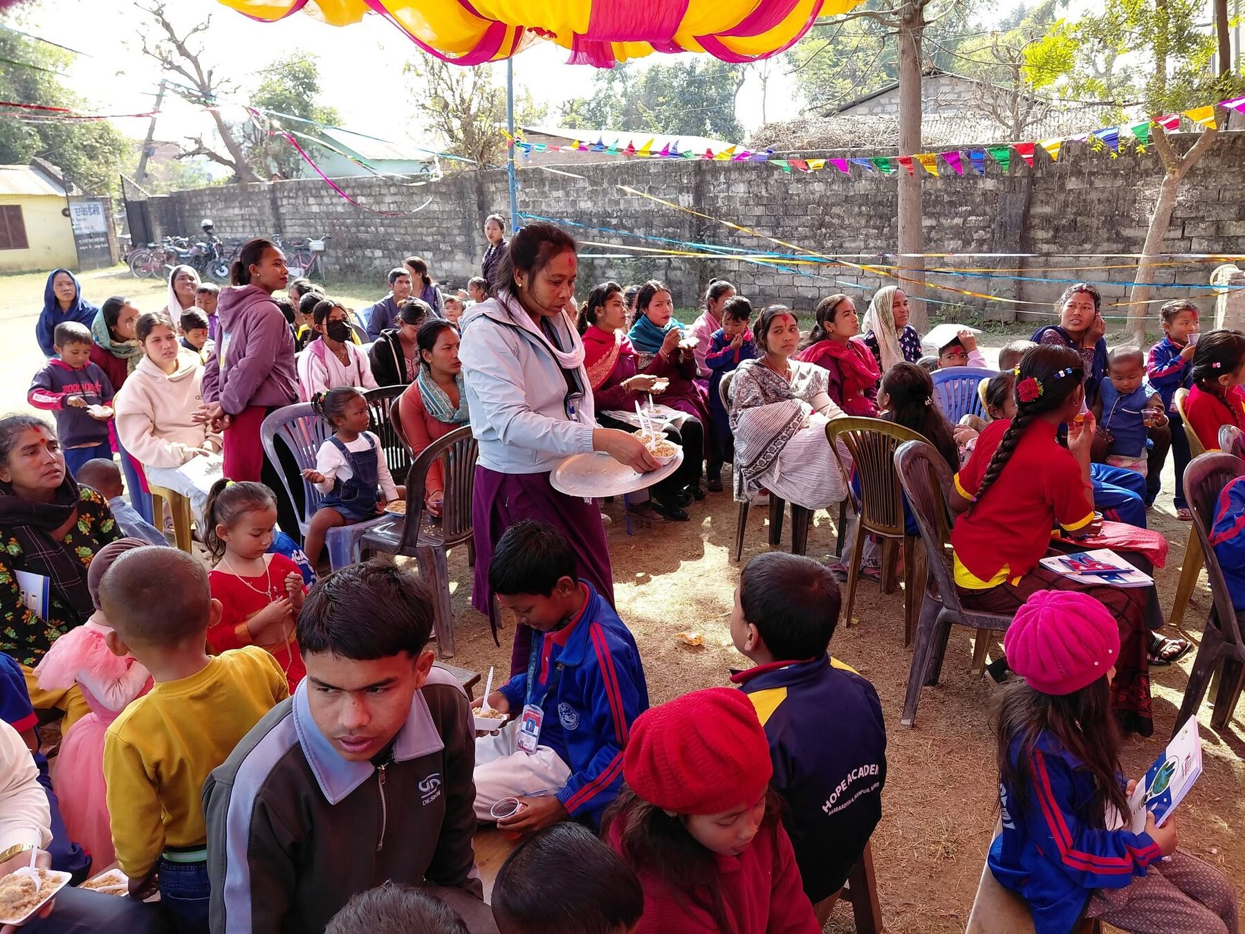 A student receiving a prize from teachers at the annual ceremony