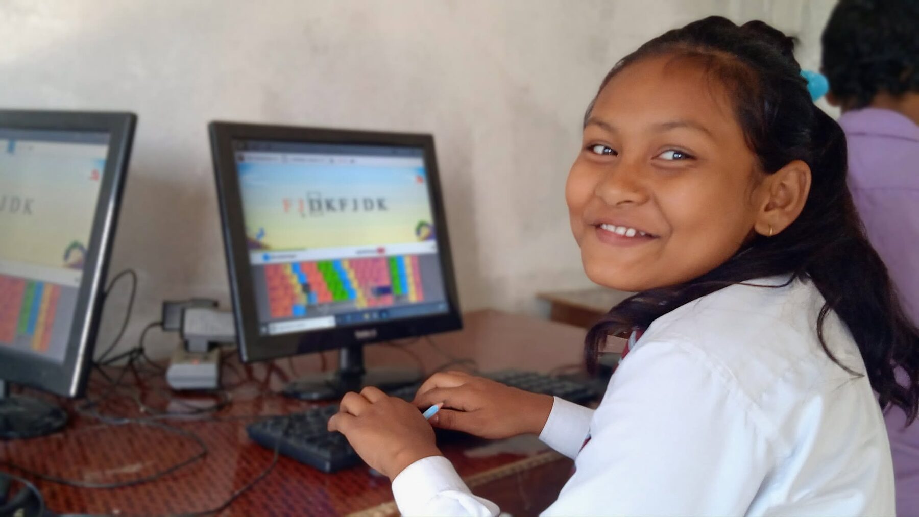 A student smiling during computer class